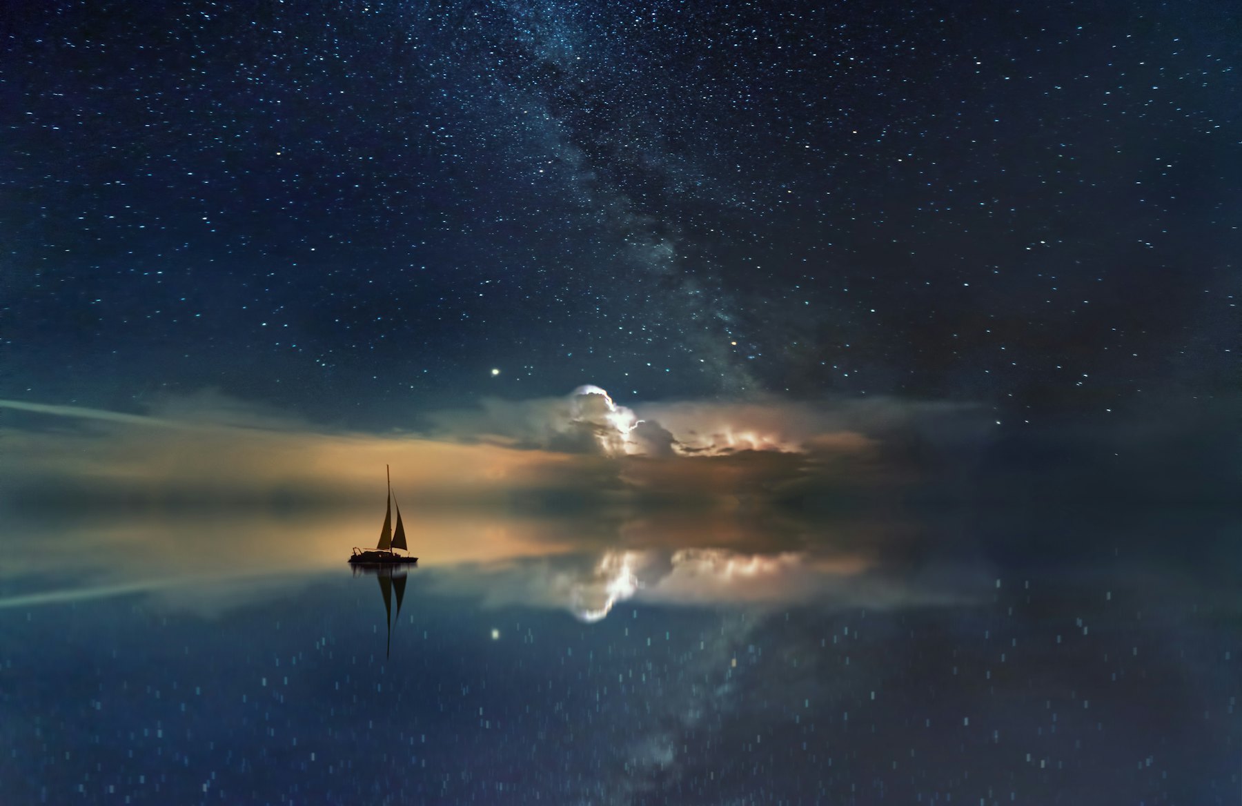 Sailboat on calm water at dusk
